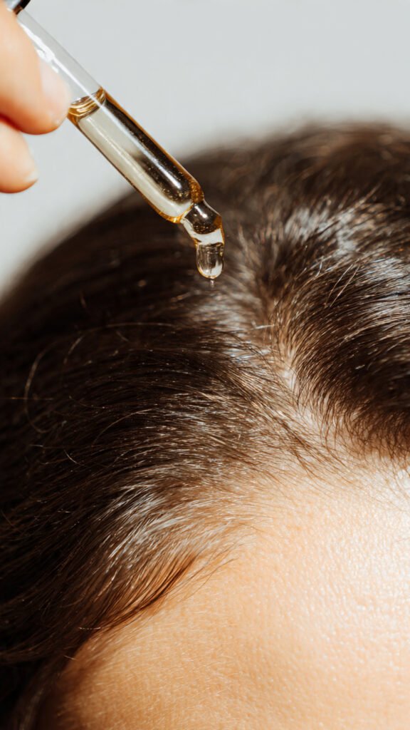 scalp care for hair growth with rosemary oil dropper on healthy scalp 2026